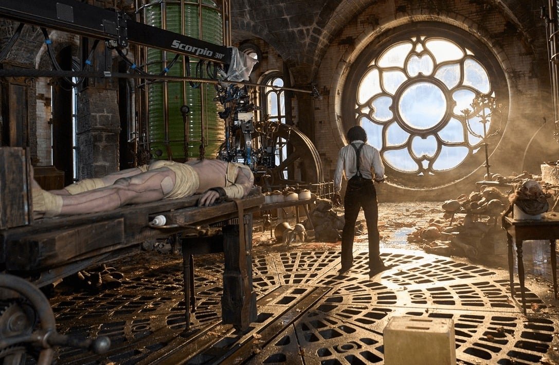 A person standing next to a body in a room with a round window AI-generated content may be incorrect.