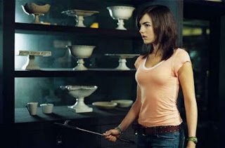 A person standing in front of shelves of bowls

AI-generated content may be incorrect.