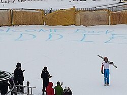 A group of people standing in the snow
AI-generated content may be incorrect.