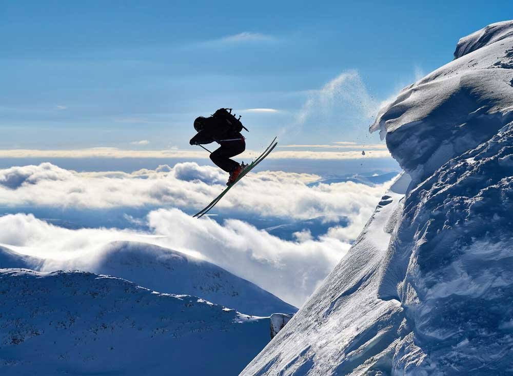 A person jumping off a mountain
AI-generated content may be incorrect.